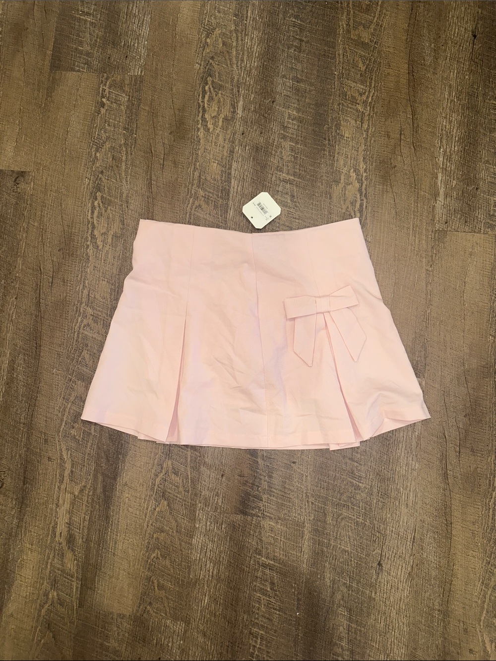 NEW ALTER’D STATE- Light Pink Pleated Mini Skirt with Bow Detail